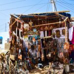 Craft stall selling beadwork, baskets and carvings at a souvenir market
