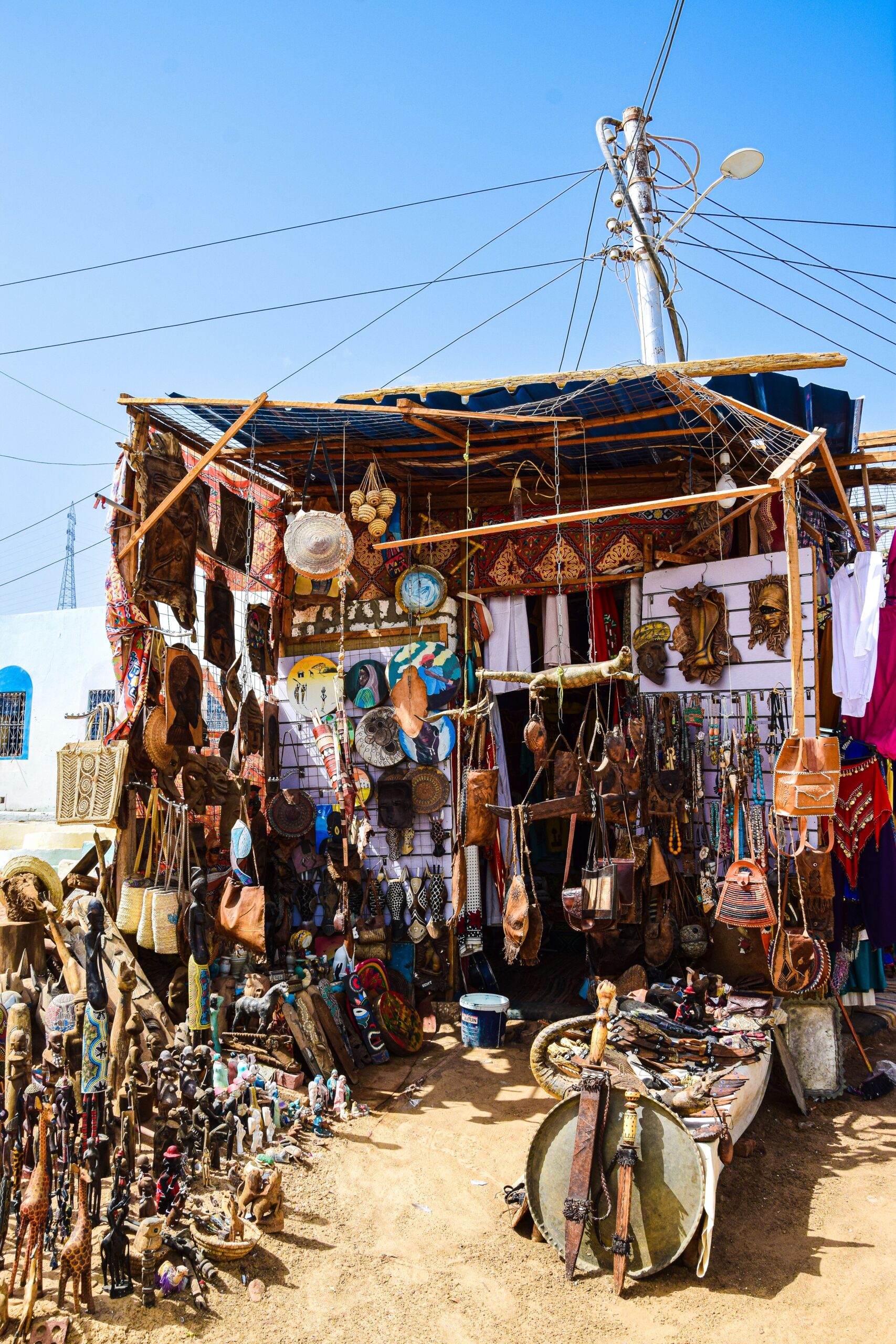 Craft stall selling beadwork, baskets and carvings at a souvenir market